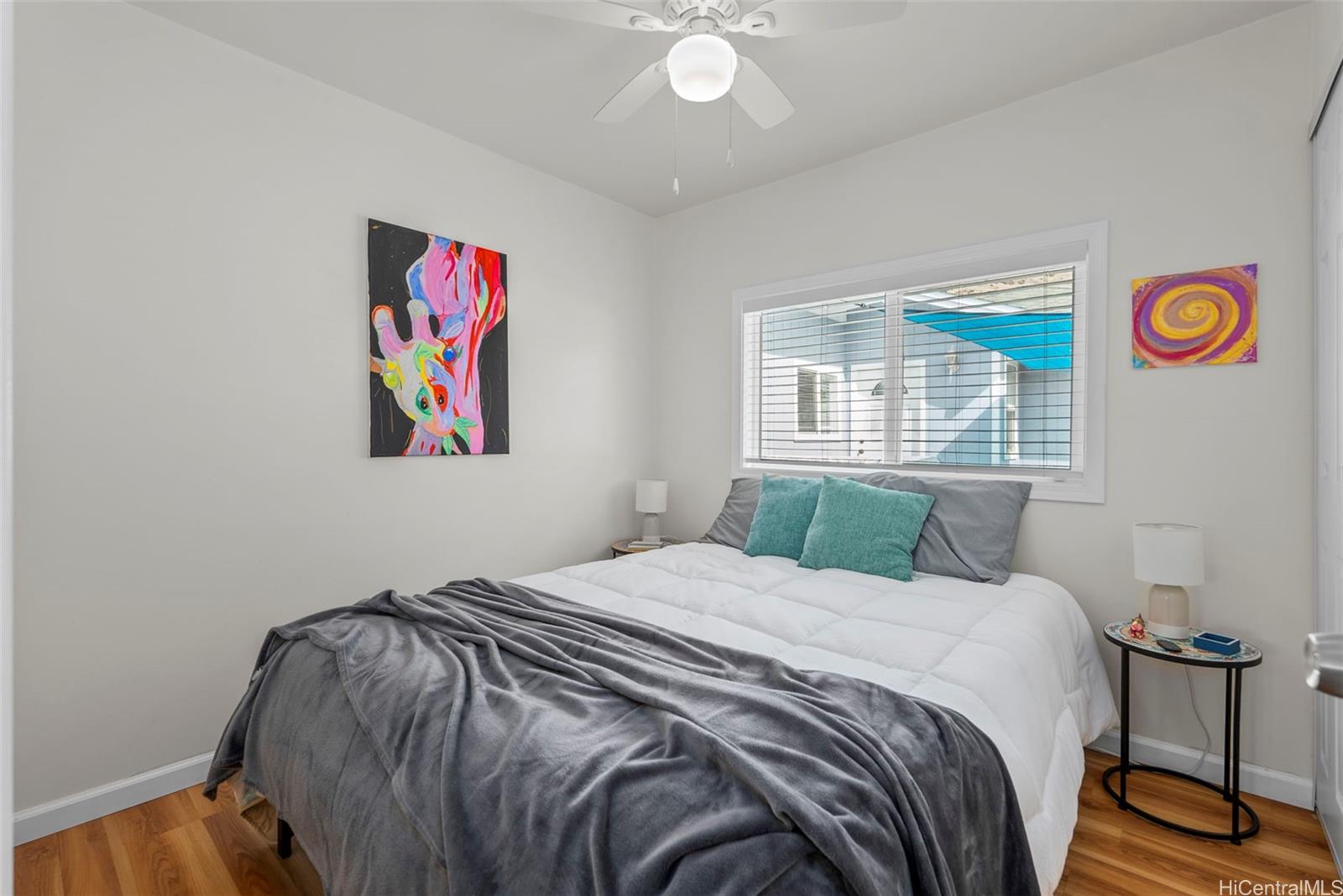 87-1423 Akowai Road Waianae, HI 96792 - Photo 8 of 24 a bedroom with a bed and a painting on the wall