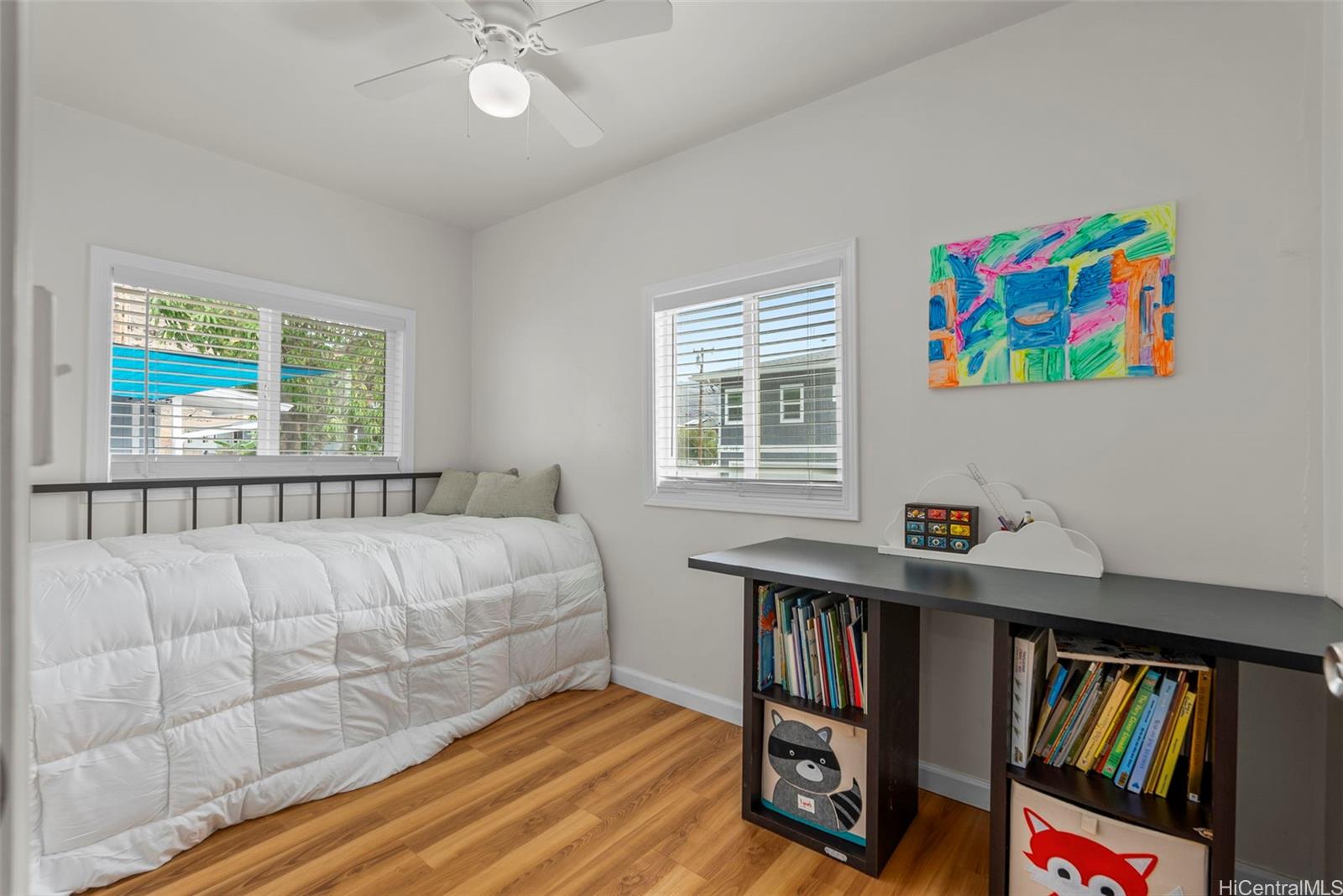 87-1423 Akowai Road Waianae, HI 96792 - Photo 9 of 24 a bed room with a bed and a book shelf