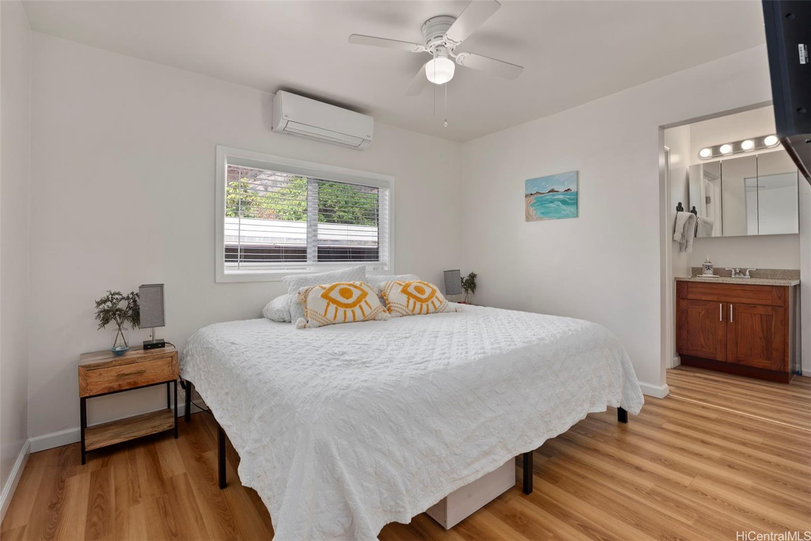 87-1423 Akowai Road Waianae, HI 96792 - Photo 10 of 24 a bedroom with a bed and a table