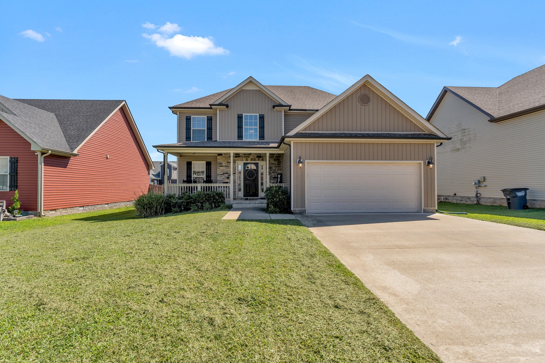 723 Backwind Lane Clarksville, TN 37040 - Photo 1 of 29 a front view of a house with a yard and garage