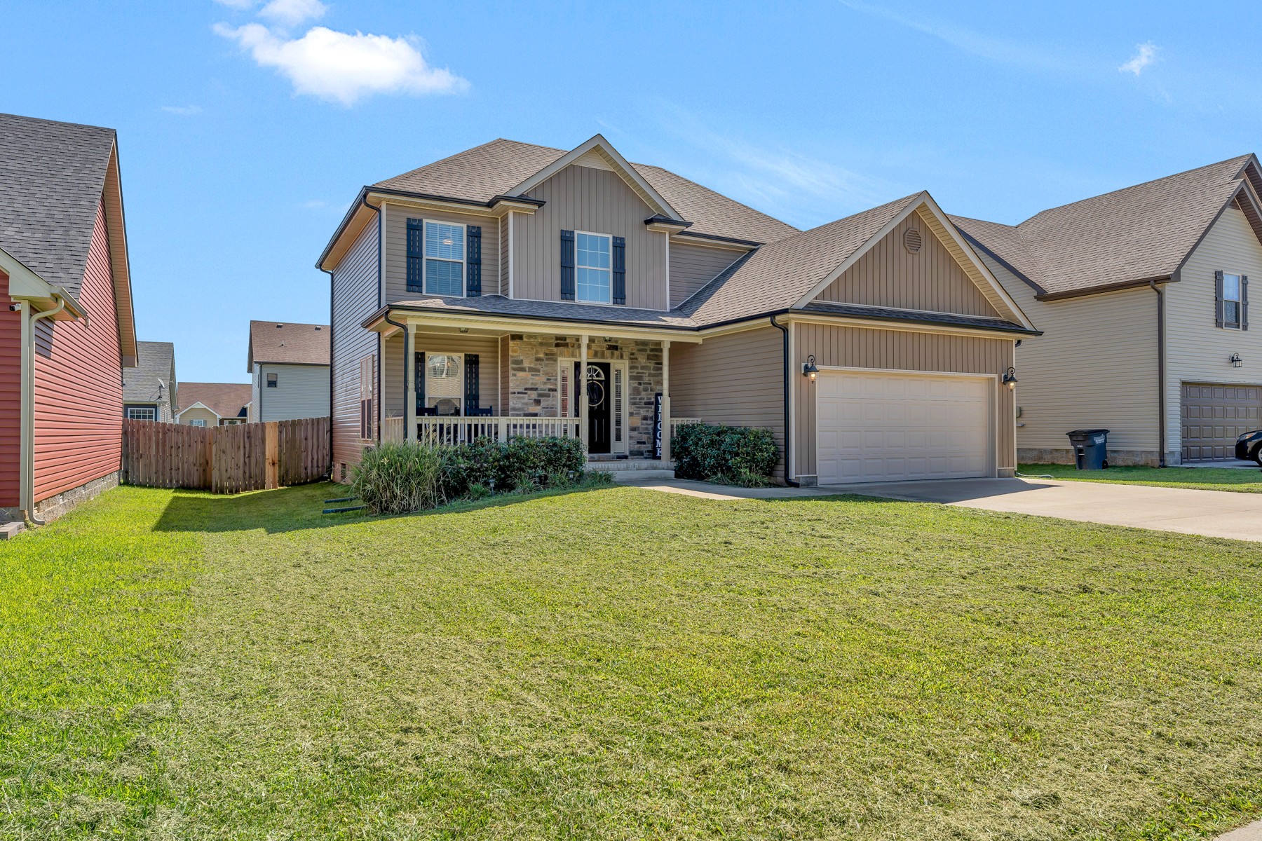 723 Backwind Lane Clarksville, TN 37040 - Photo 2 of 29 a front view of a house with a yard and garage