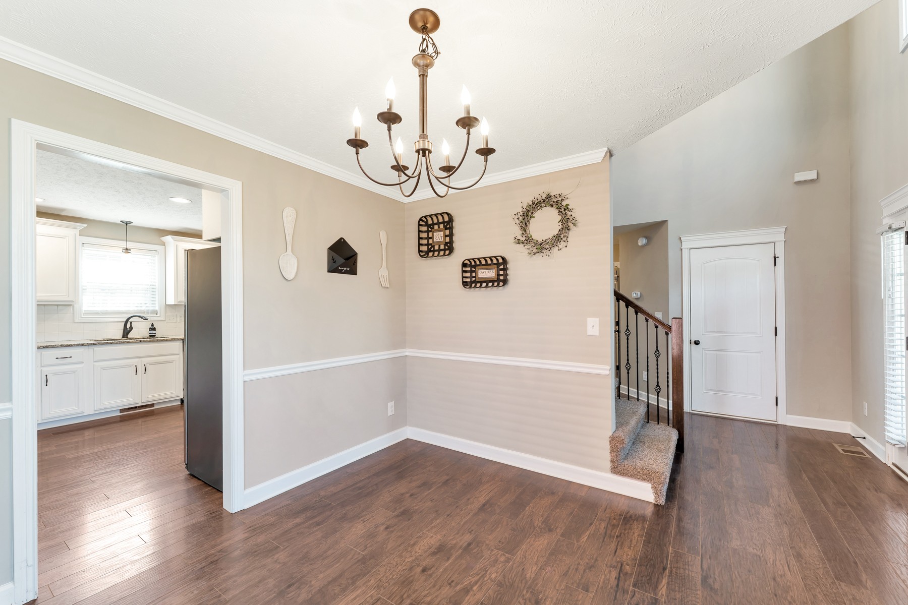 723 Backwind Lane Clarksville, TN 37040 - Photo 13 of 29 a view of a hallway with wooden floor and a kitchen