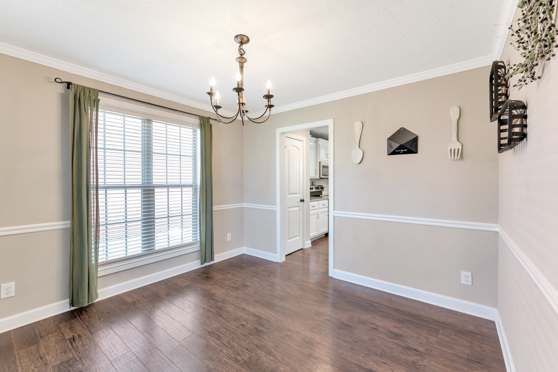 723 Backwind Lane Clarksville, TN 37040 - Photo 14 of 29 wooden floor in an empty room with a window
