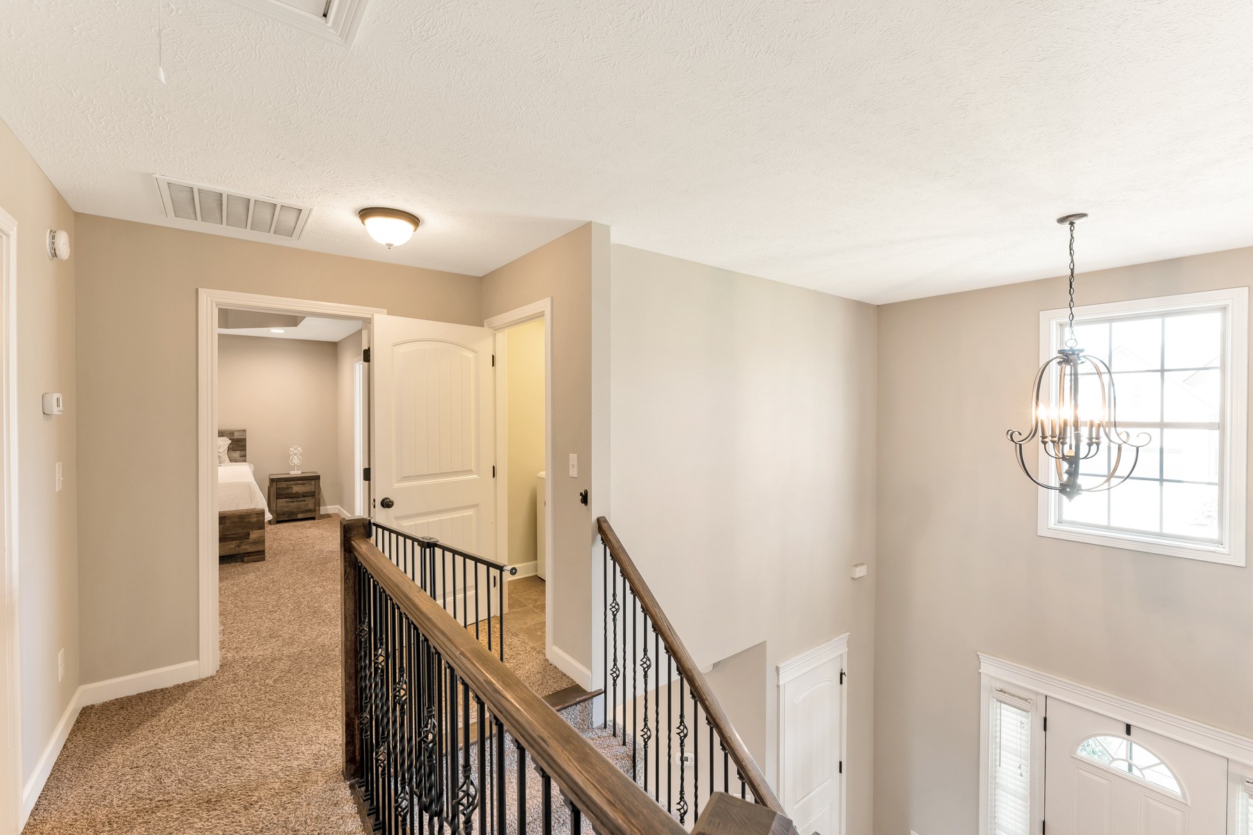 723 Backwind Lane Clarksville, TN 37040 - Photo 15 of 29 a view of a hallway with windows and stairs