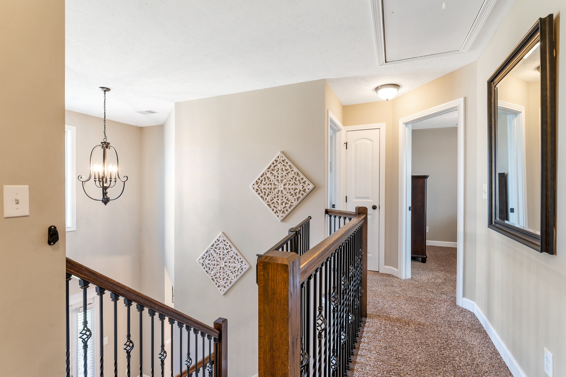 723 Backwind Lane Clarksville, TN 37040 - Photo 16 of 29 a view of a hallway to a livingroom with wooden floor and staircase