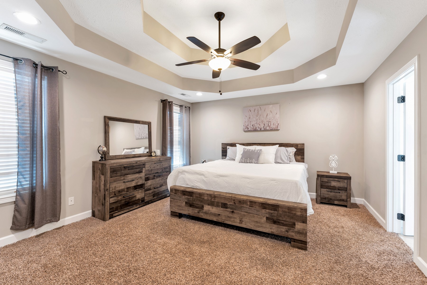723 Backwind Lane Clarksville, TN 37040 - Photo 17 of 29 a bedroom with a bed and a chandelier