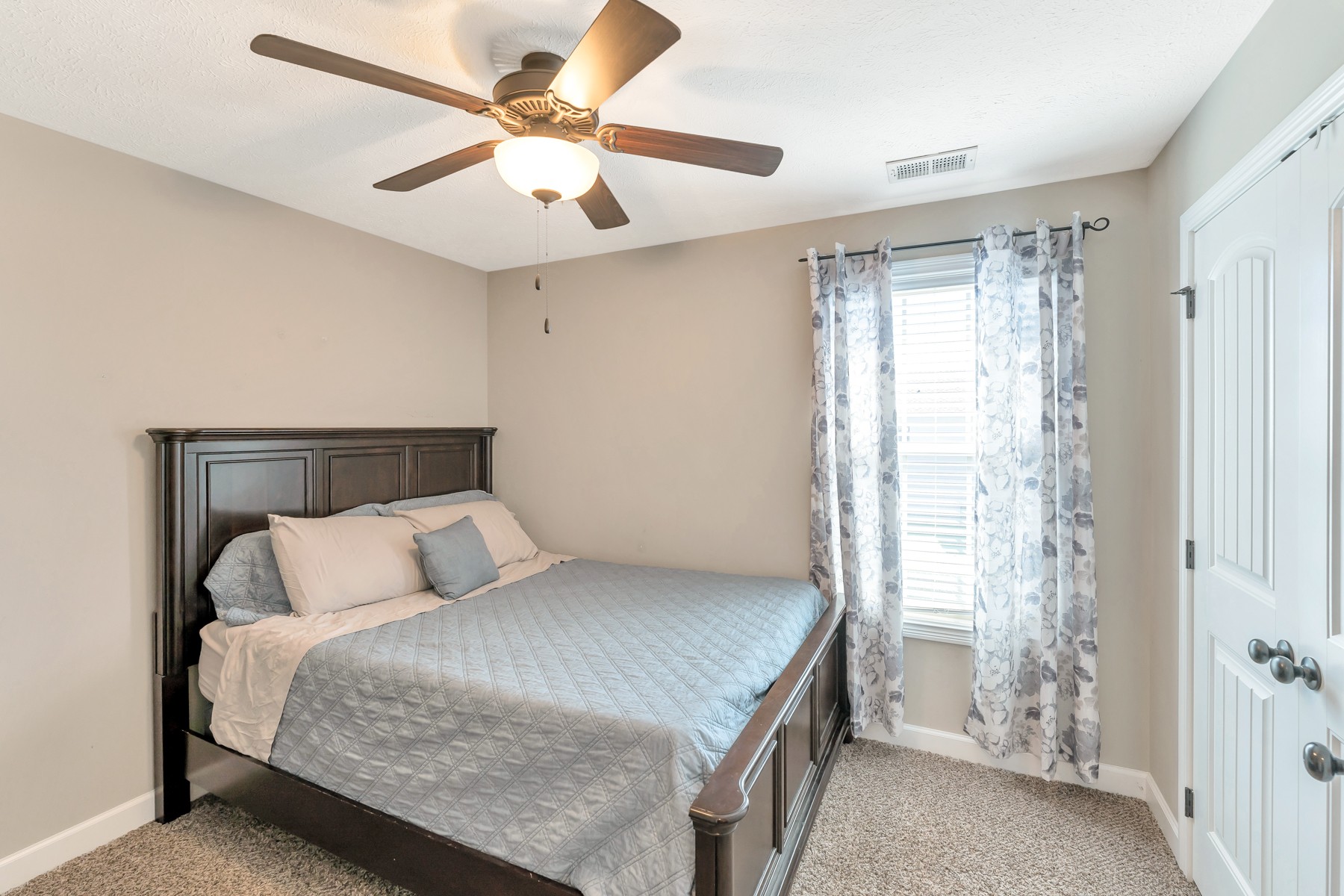 723 Backwind Lane Clarksville, TN 37040 - Photo 22 of 29 a bedroom with a balcony a bed and a chandelier