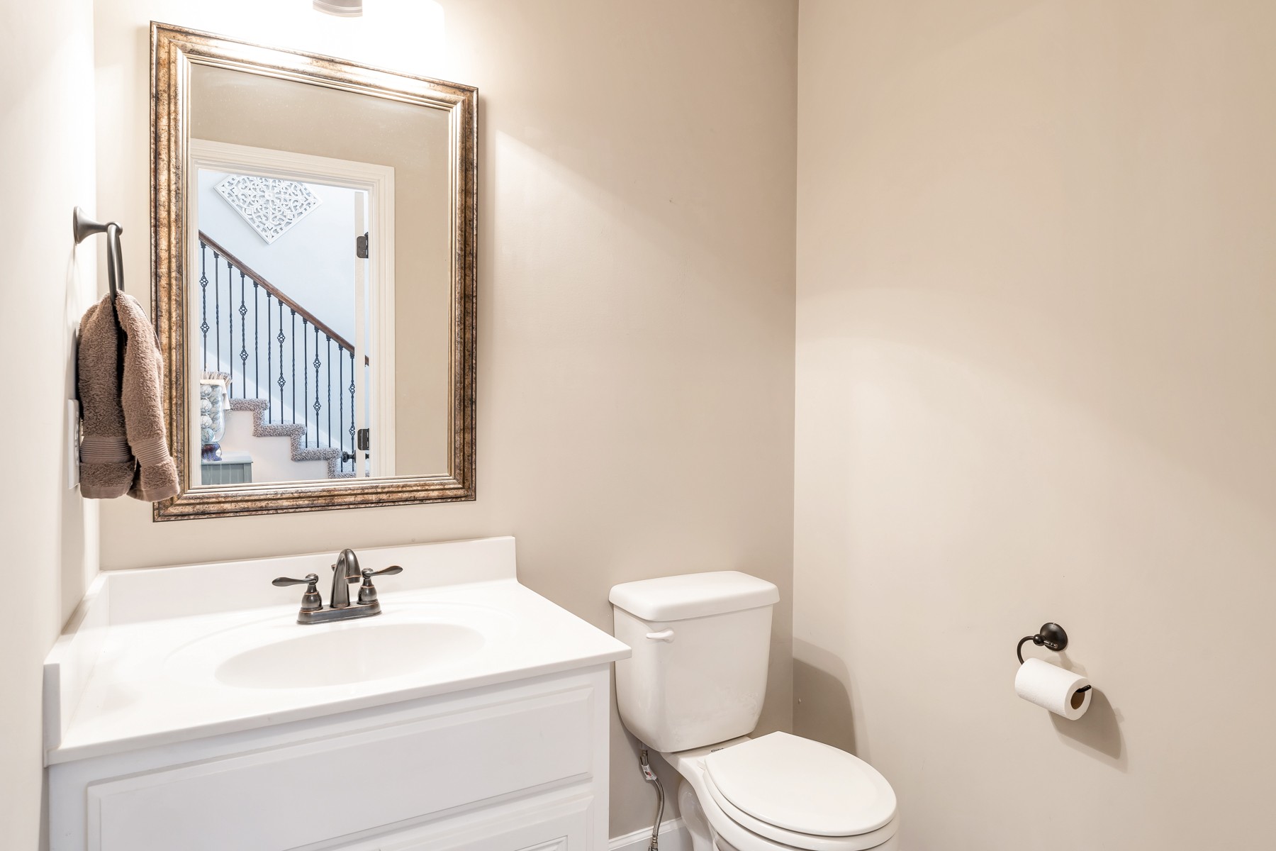 723 Backwind Lane Clarksville, TN 37040 - Photo 24 of 29 a bathroom with a toilet a sink and mirror