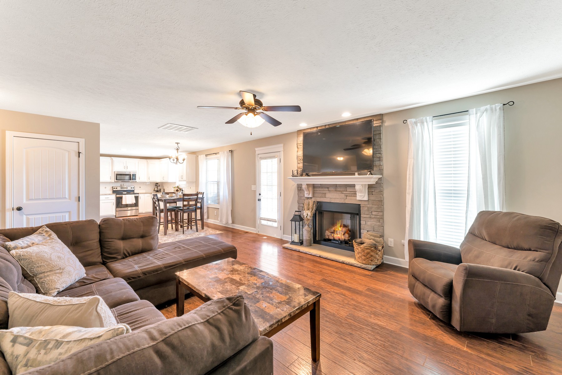 723 Backwind Lane Clarksville, TN 37040 - Photo 7 of 29 a living room with furniture fireplace and a large window