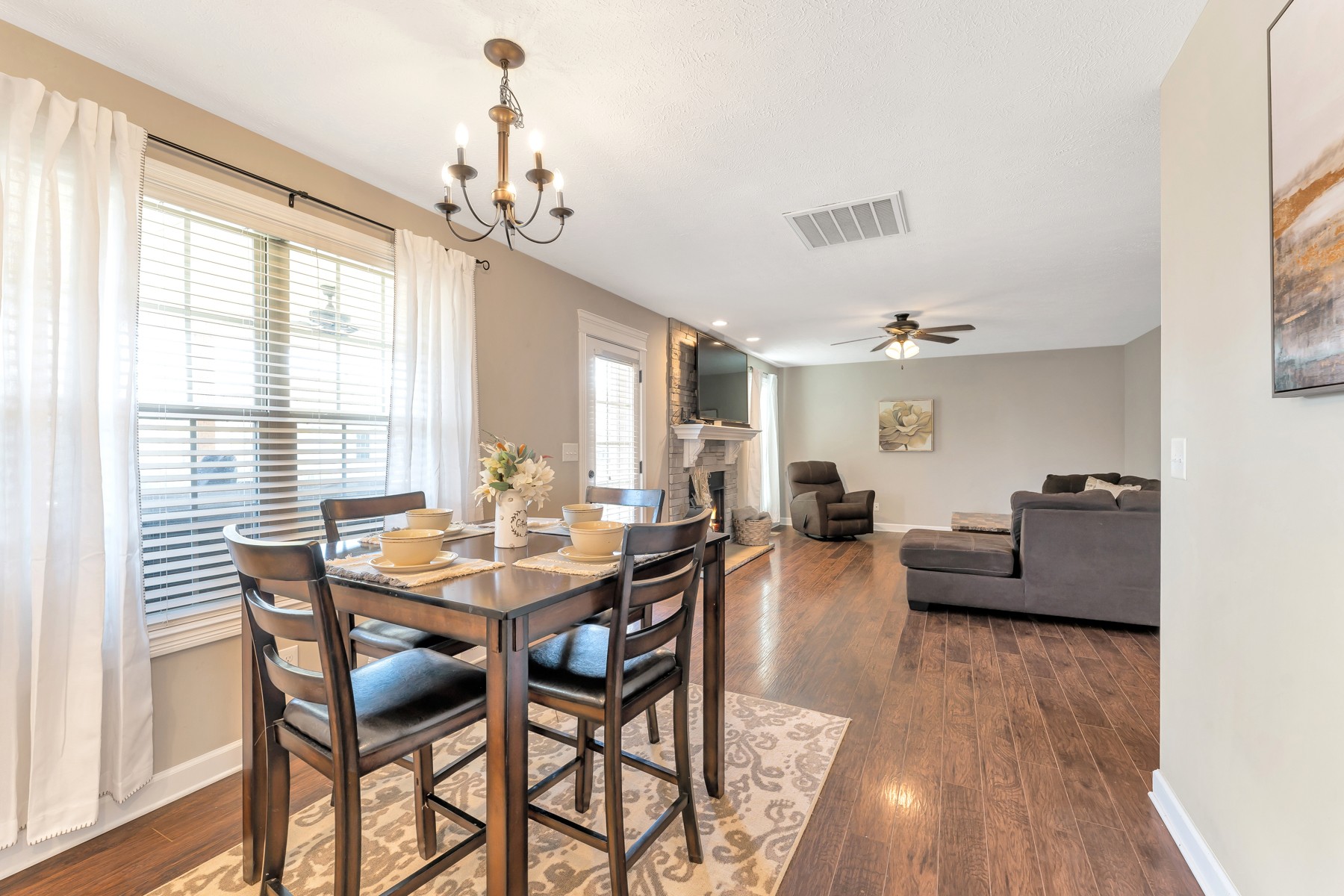723 Backwind Lane Clarksville, TN 37040 - Photo 9 of 29 a view of a dining room with furniture window and wooden floor