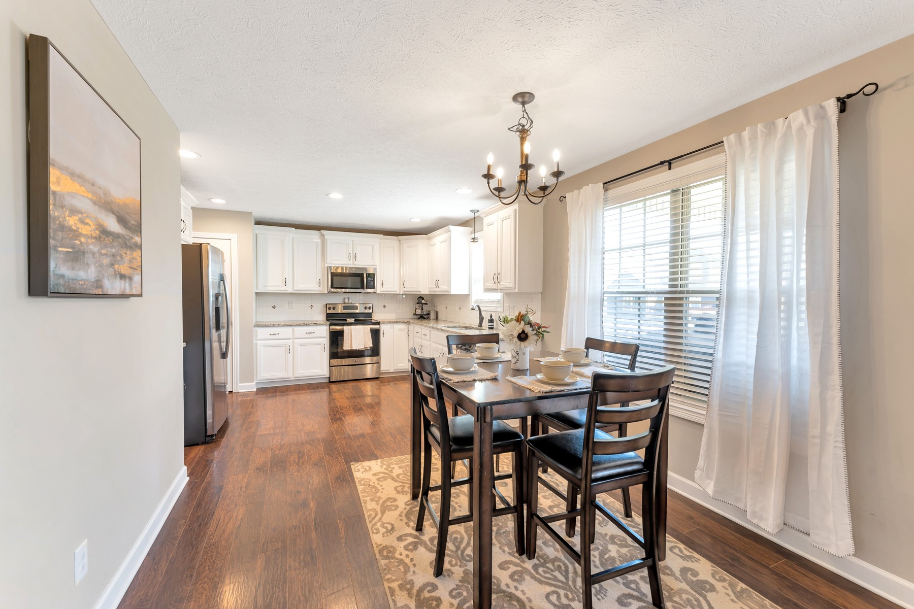 723 Backwind Lane Clarksville, TN 37040 - Photo 10 of 29 a view of a dining room with furniture window and wooden floor