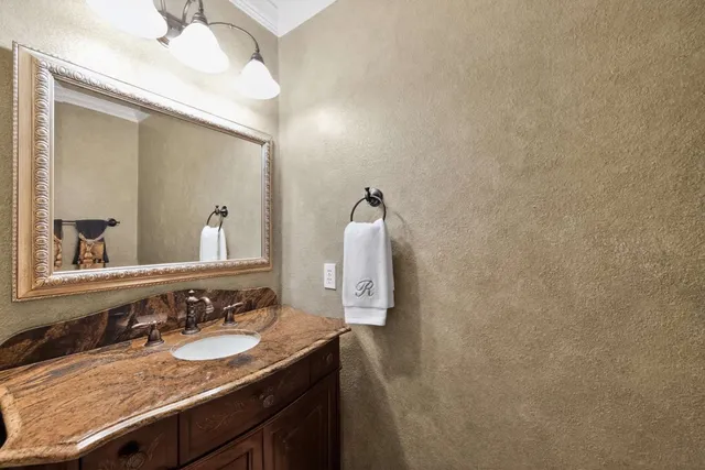 a bed room with a bed and a chandelier