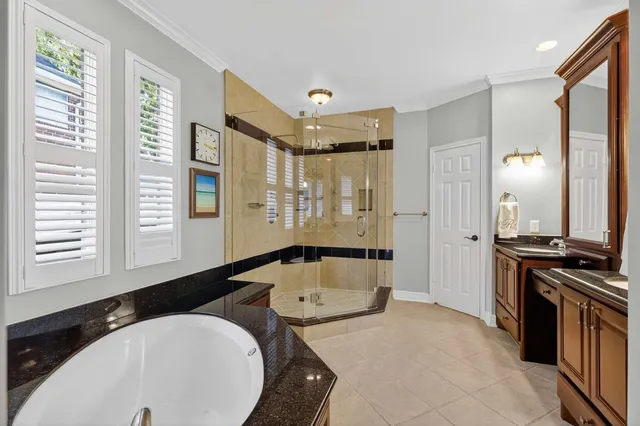 a kitchen with stainless steel appliances granite countertop a sink a stove and a refrigerator