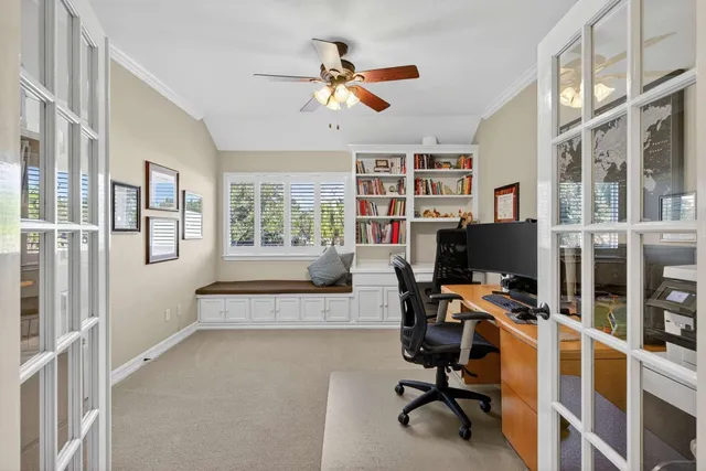 a view of a workspace with furniture and workspace