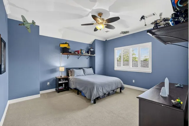 a view of a hallway with wooden floor and windows