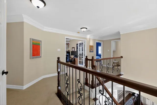 a bathroom with a granite countertop toilet sink and mirror
