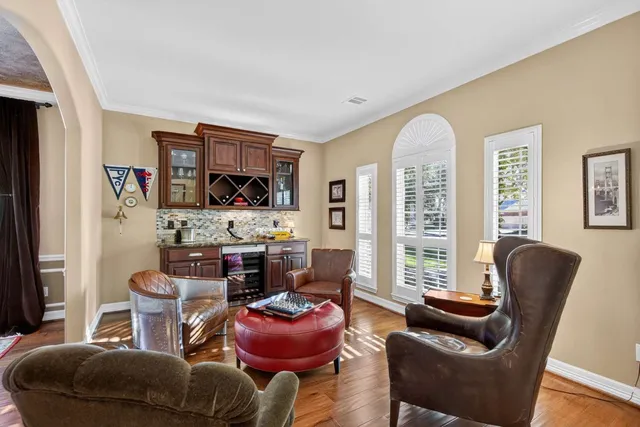 a view of a dining room with furniture and wooden floor
