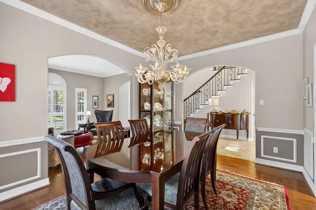 a view of a dining room with furniture and window