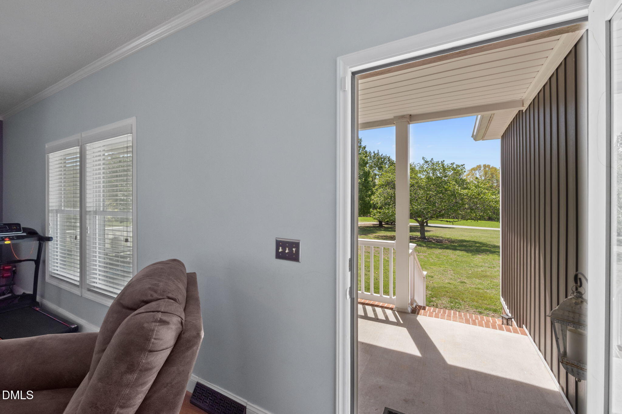 236 Dirgie Mine Road Roxboro, NC 27574 - Photo 14 of 55 a view of a porch with furniture and floor to ceiling window