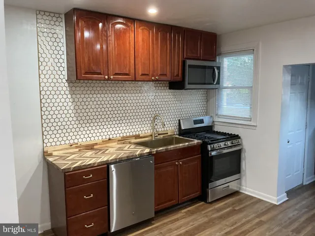 a kitchen with a stove and a microwave