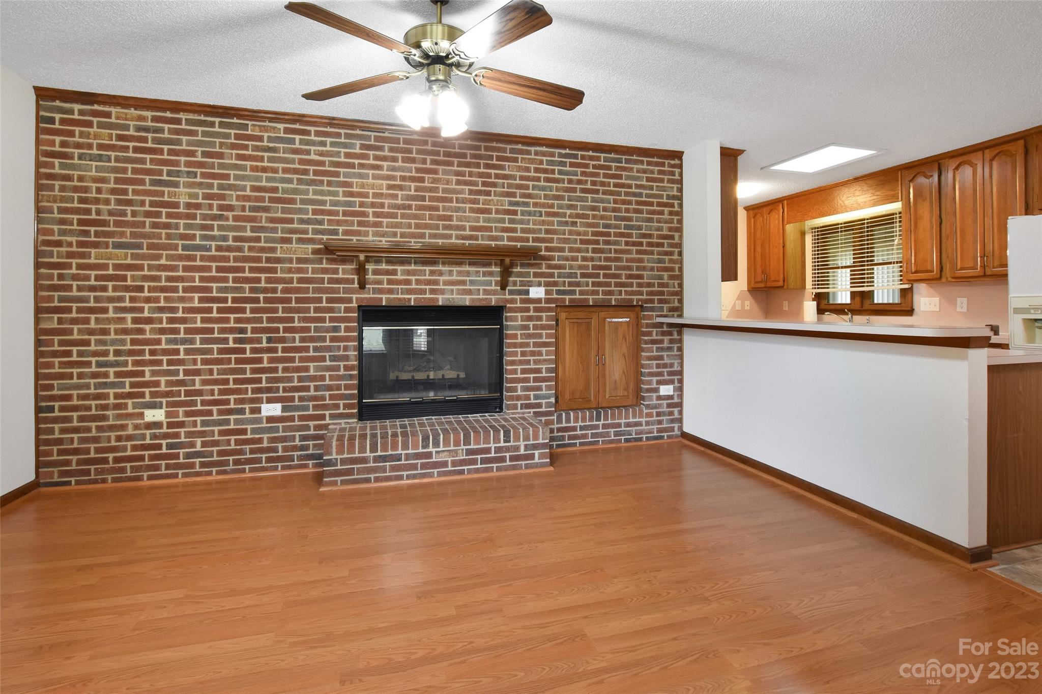 3075 Stoneybrook Drive Fort Mill, SC 29708 - Photo 11 of 31 a view of an empty room with a fireplace and a window