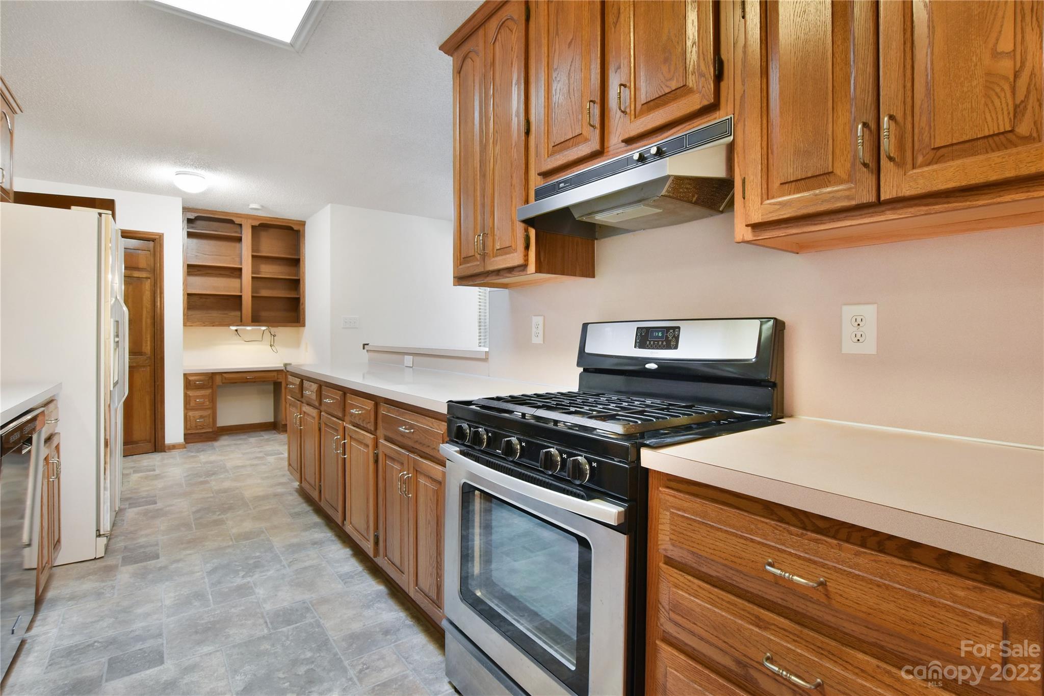 3075 Stoneybrook Drive Fort Mill, SC 29708 - Photo 13 of 31 a kitchen with stainless steel appliances granite countertop a stove and a refrigerator