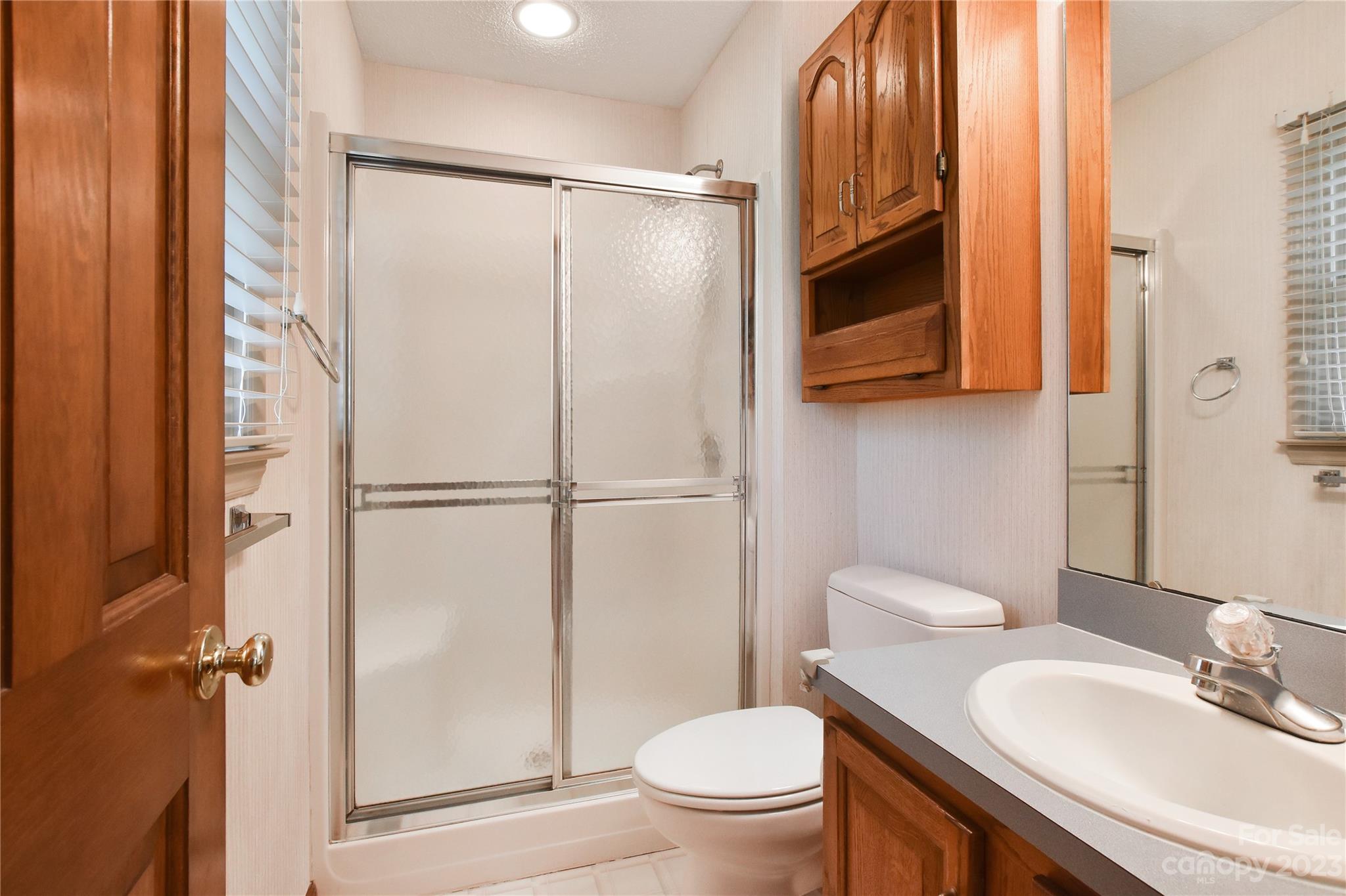 3075 Stoneybrook Drive Fort Mill, SC 29708 - Photo 20 of 31 a bathroom with a sink toilet and shower