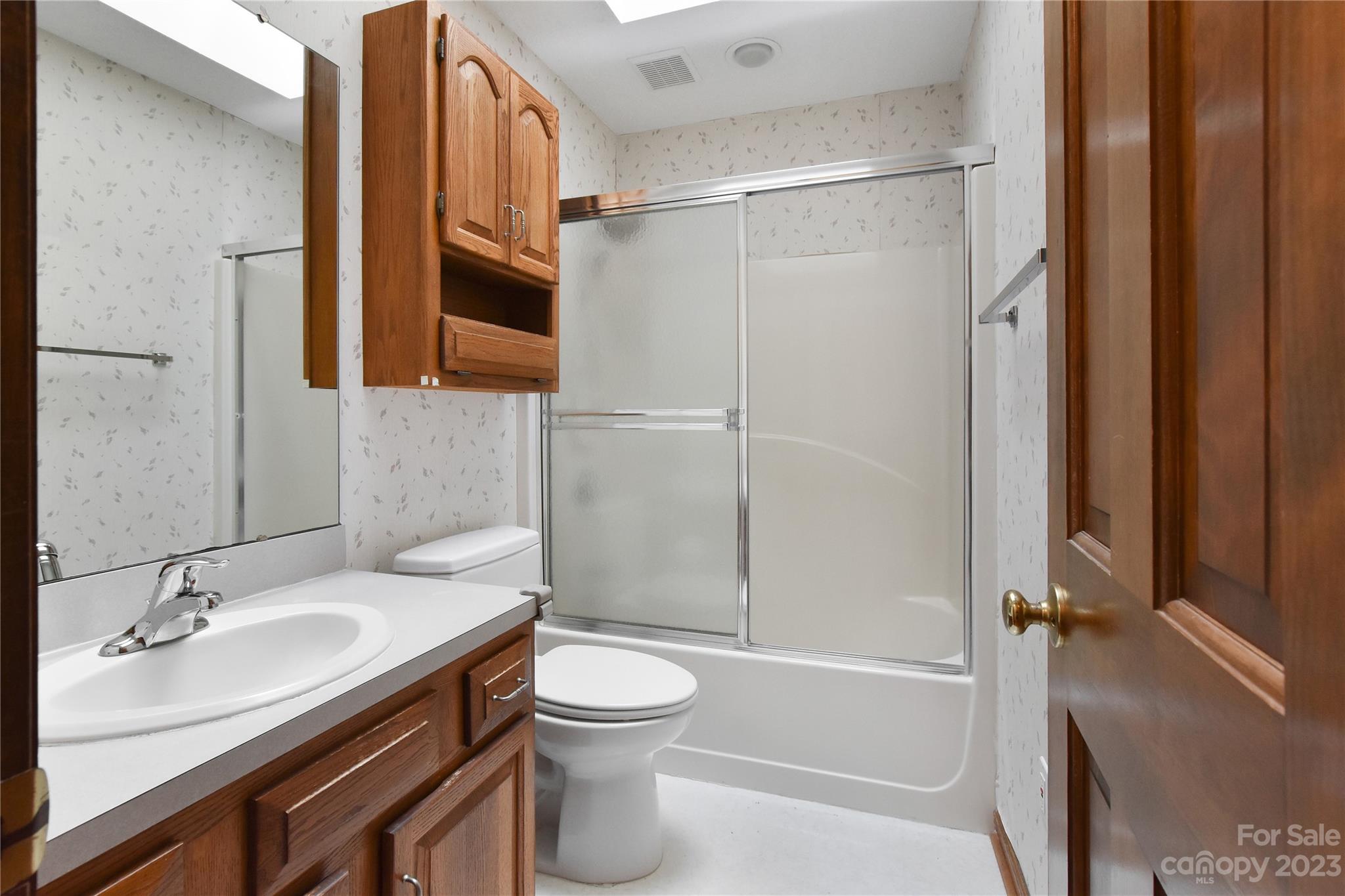 3075 Stoneybrook Drive Fort Mill, SC 29708 - Photo 21 of 31 a bathroom with a granite countertop sink toilet and shower