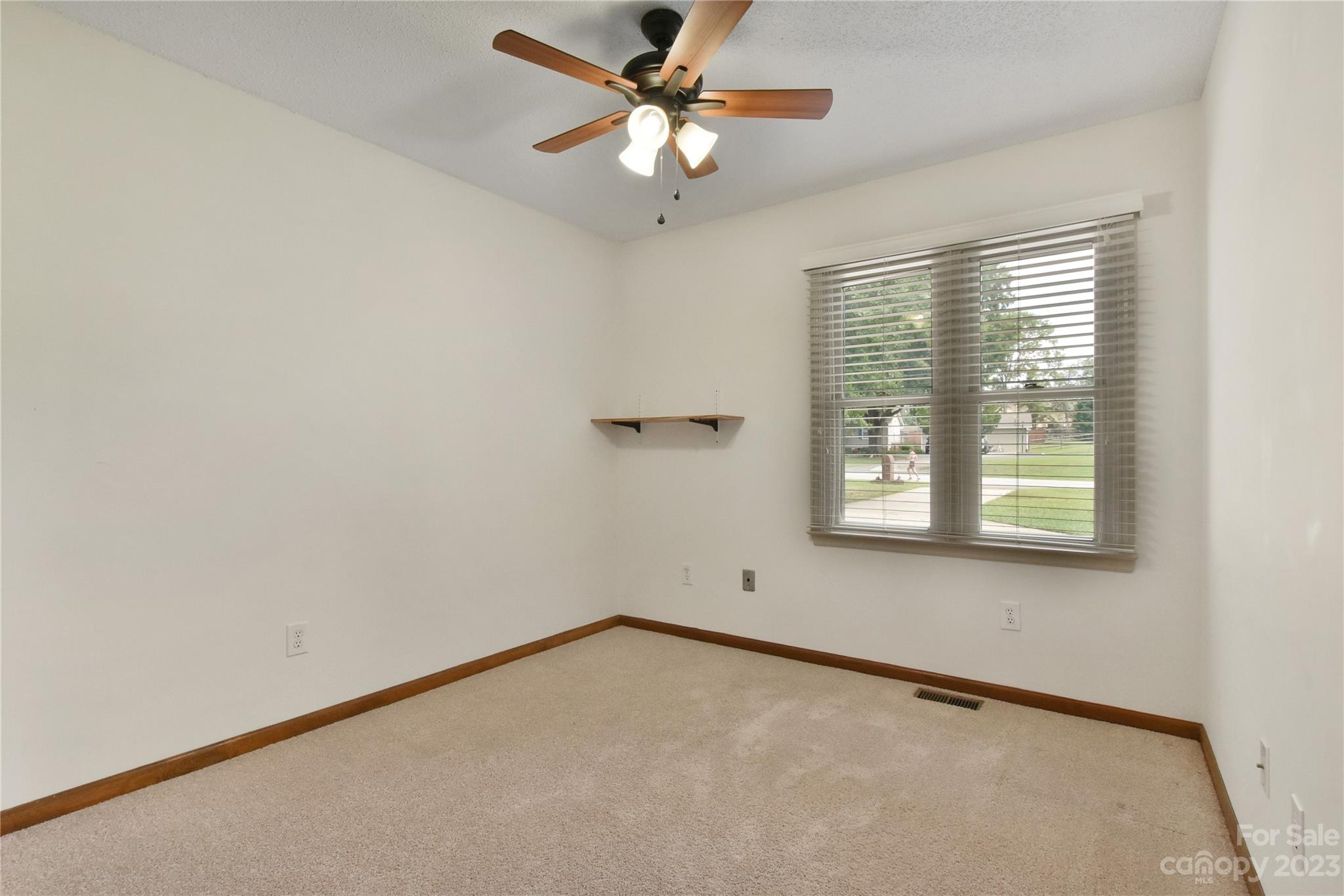 3075 Stoneybrook Drive Fort Mill, SC 29708 - Photo 22 of 31 an empty room with a window and a fan