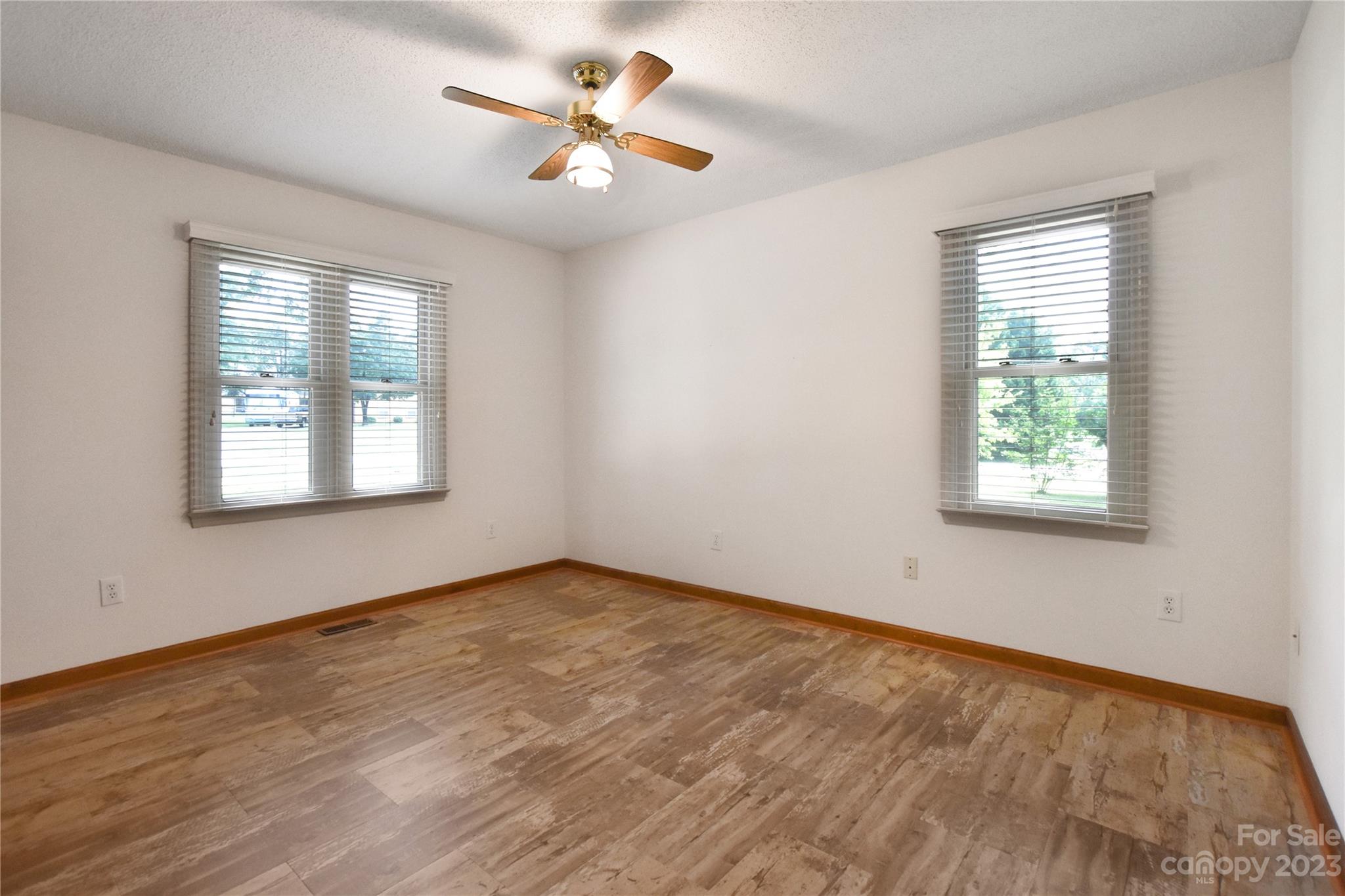 3075 Stoneybrook Drive Fort Mill, SC 29708 - Photo 23 of 31 wooden floor in an empty room with a window