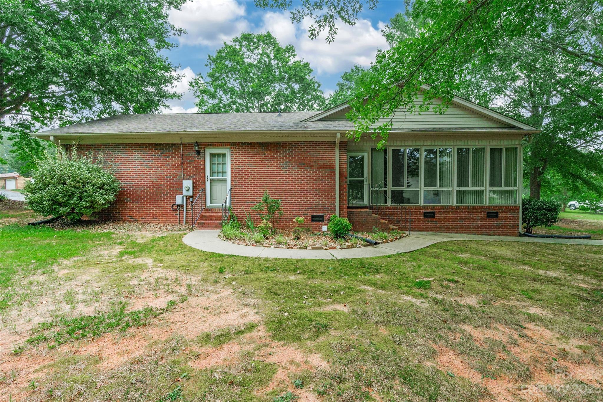 3075 Stoneybrook Drive Fort Mill, SC 29708 - Photo 25 of 31 a front view of a house with a yard and potted plants