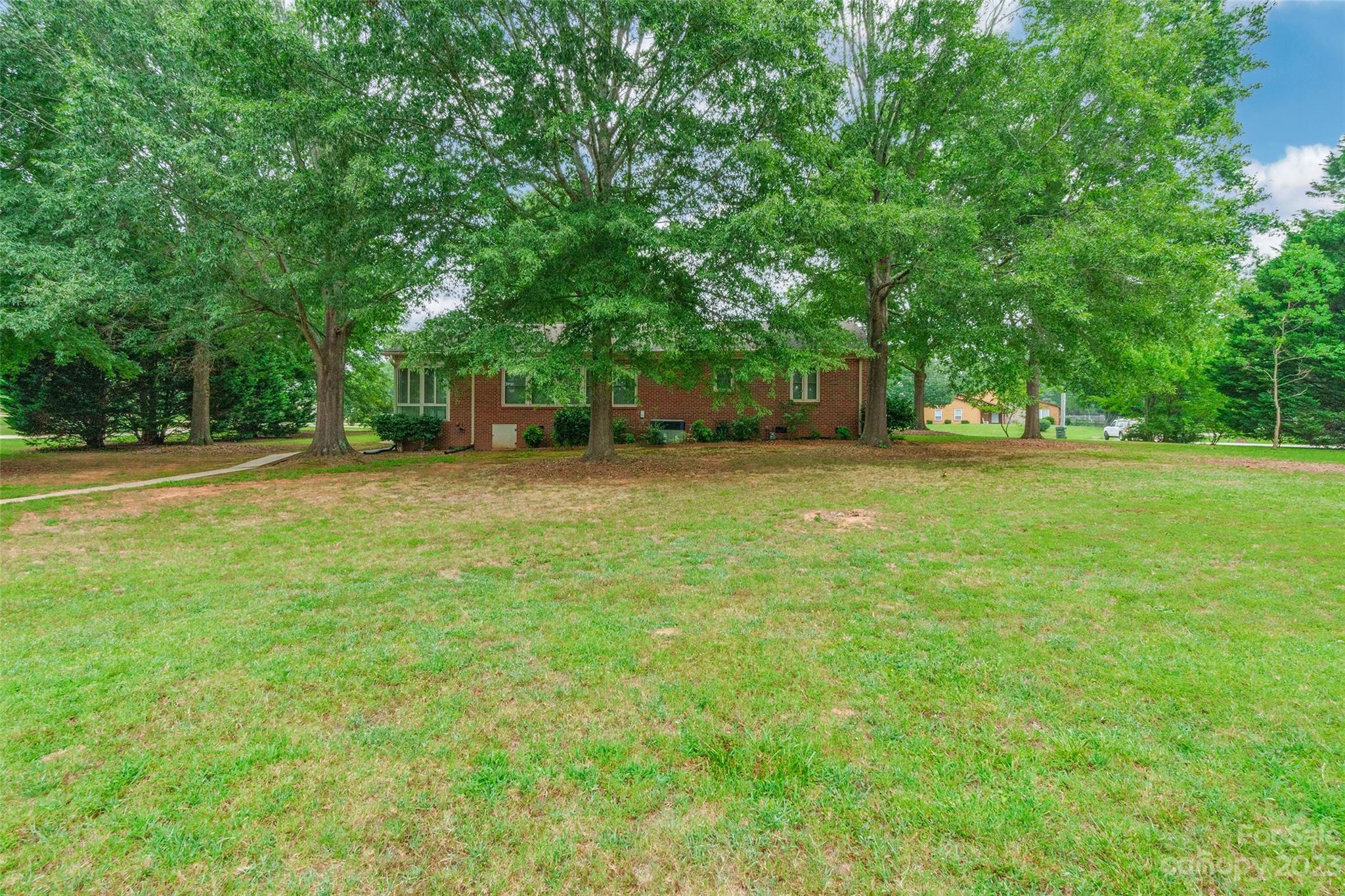 3075 Stoneybrook Drive Fort Mill, SC 29708 - Photo 26 of 31 a backyard of a house with lots of green space