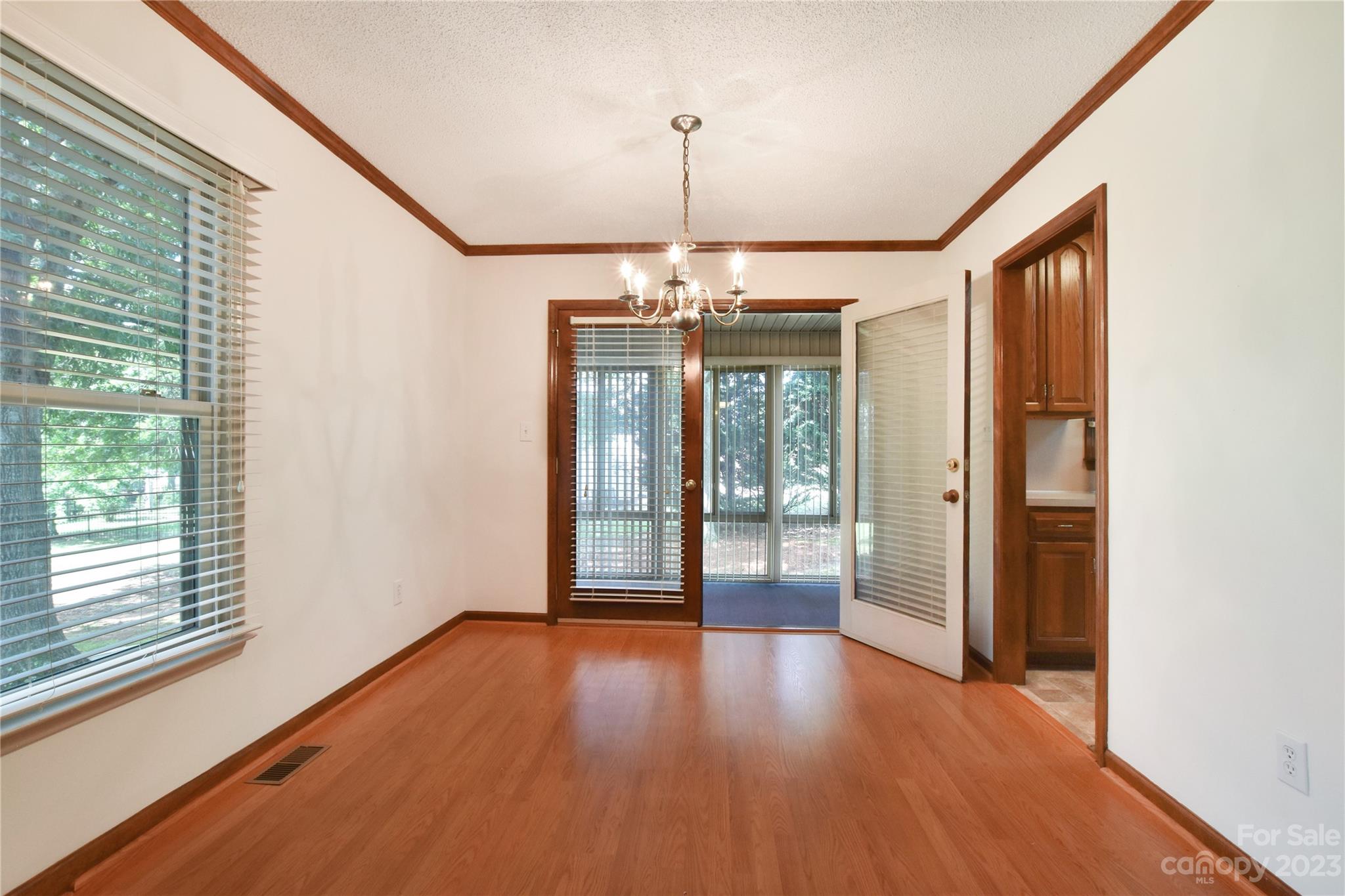 3075 Stoneybrook Drive Fort Mill, SC 29708 - Photo 8 of 31 a view of an empty room with wooden floor and a window
