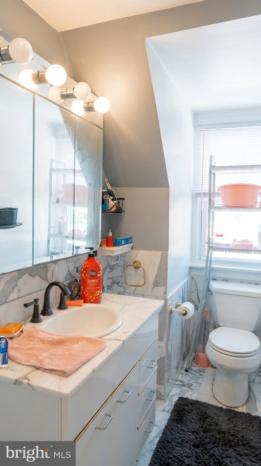 1058 Huntingdon Pike Huntingdon Valley, PA 19006 - Photo 16 of 25 a bathroom with a sink and a mirror