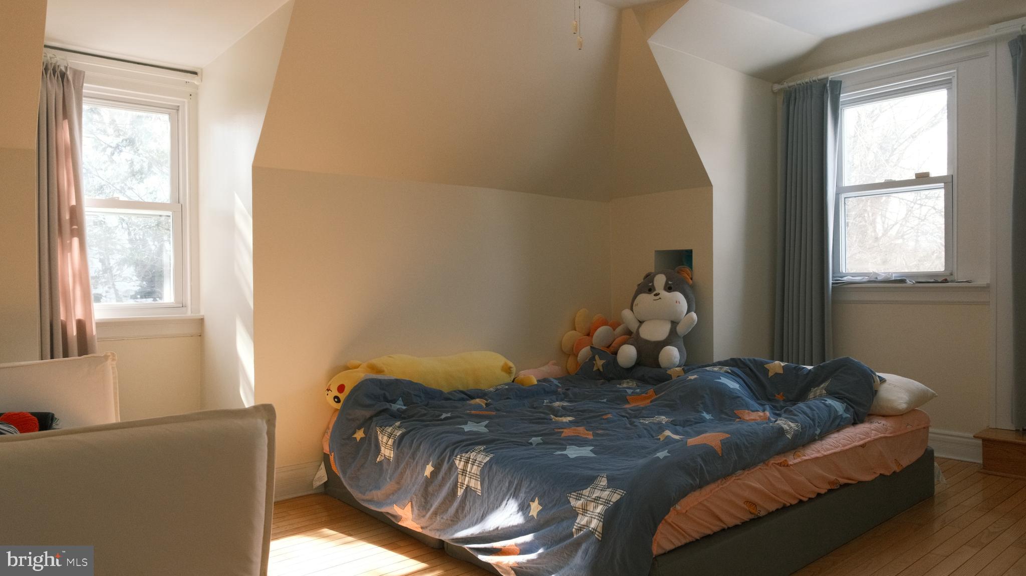 1058 Huntingdon Pike Huntingdon Valley, PA 19006 - Photo 17 of 25 a bed room with a bed window and couch