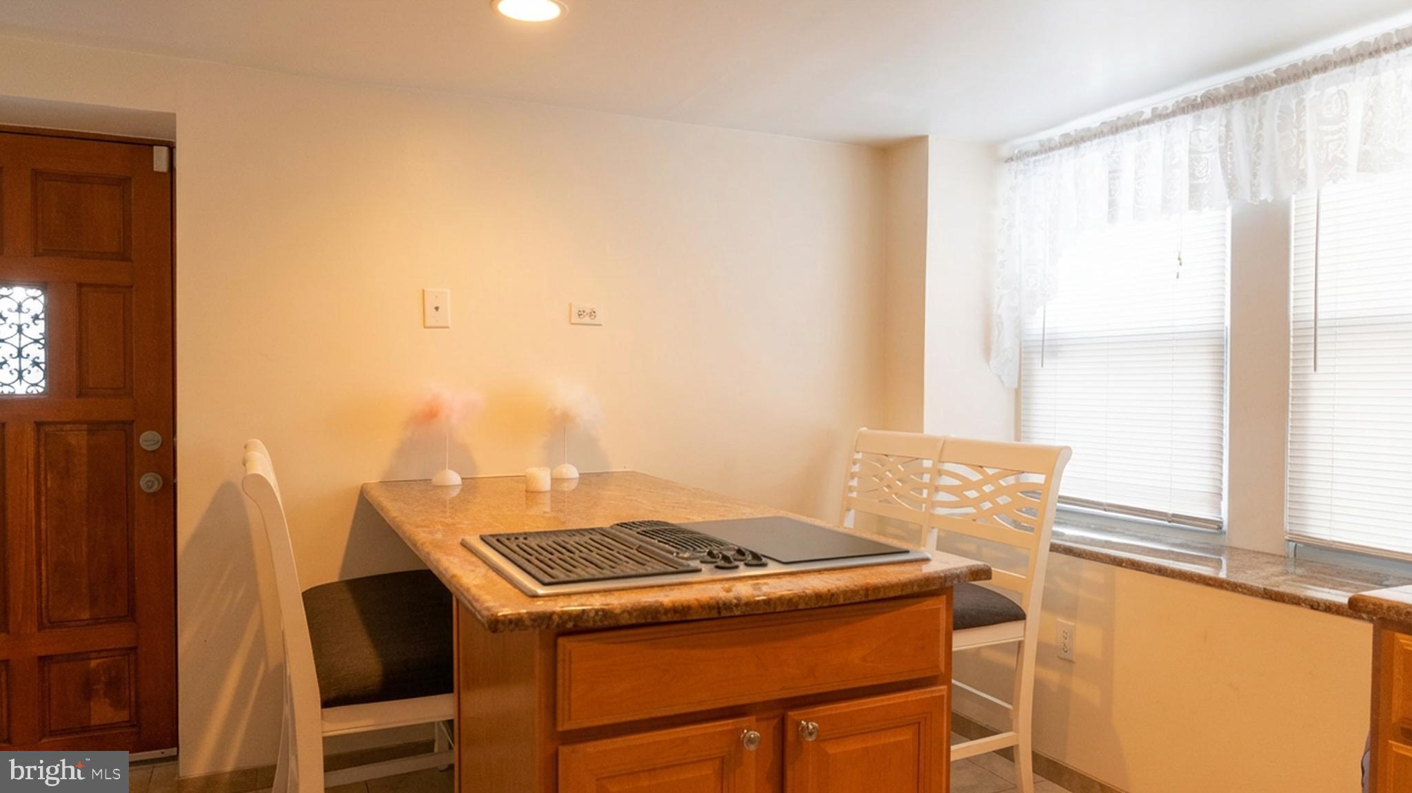 1058 Huntingdon Pike Huntingdon Valley, PA 19006 - Photo 20 of 25 a kitchen that has a stove and a table in it