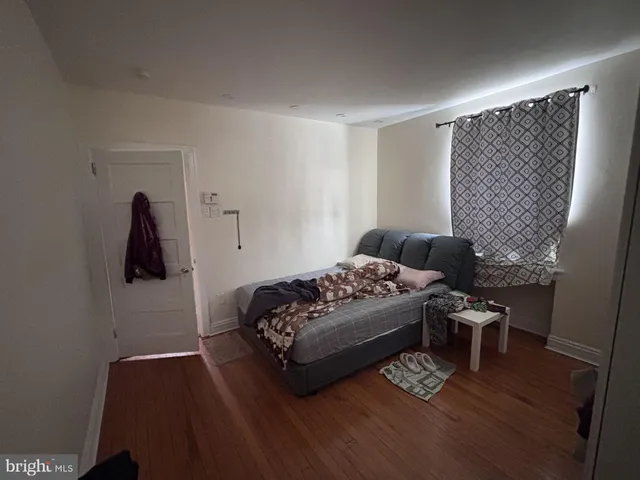 a bedroom with a bed and a chair