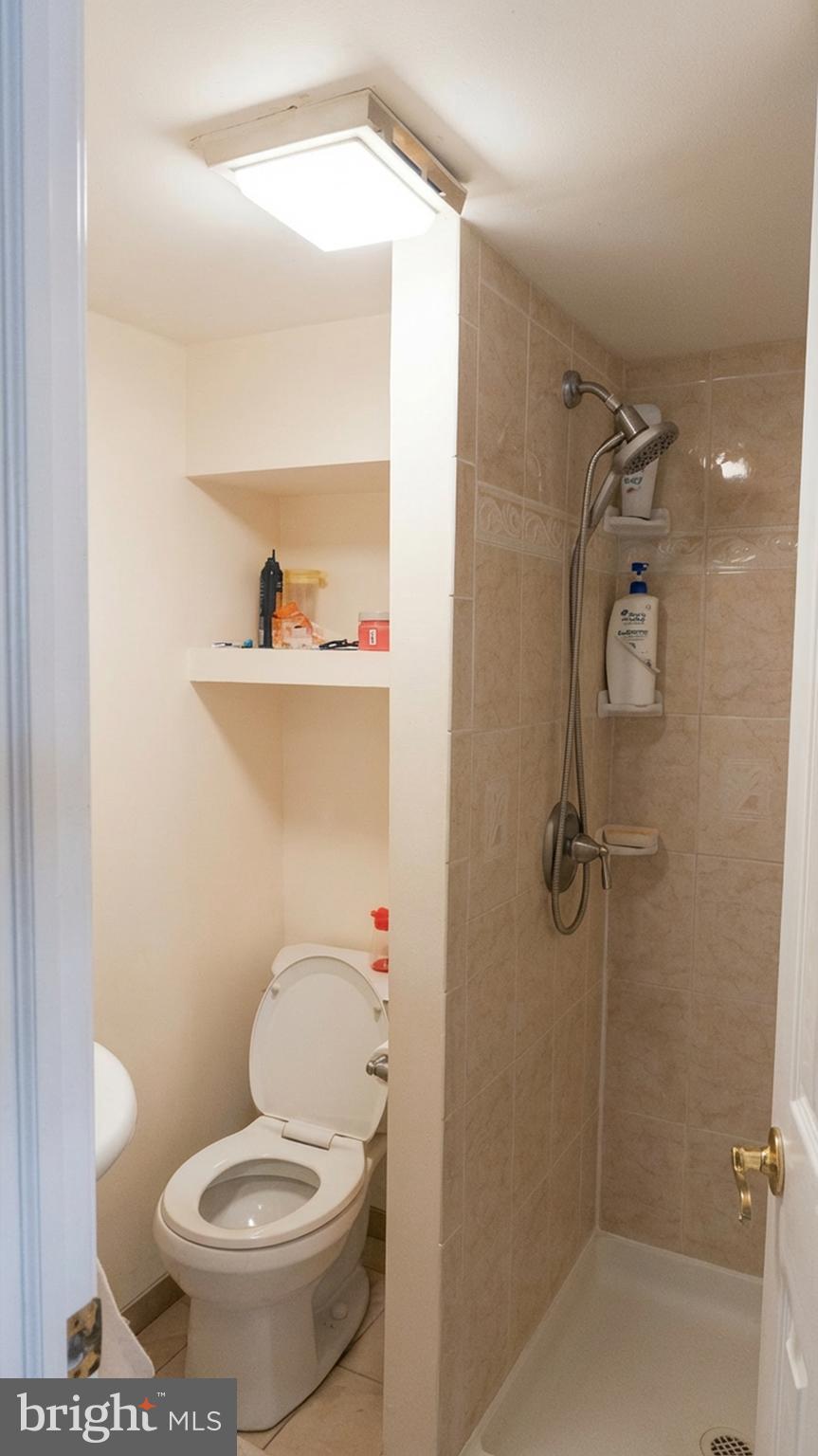 1058 Huntingdon Pike Huntingdon Valley, PA 19006 - Photo 24 of 25 a bathroom with a toilet and a shower