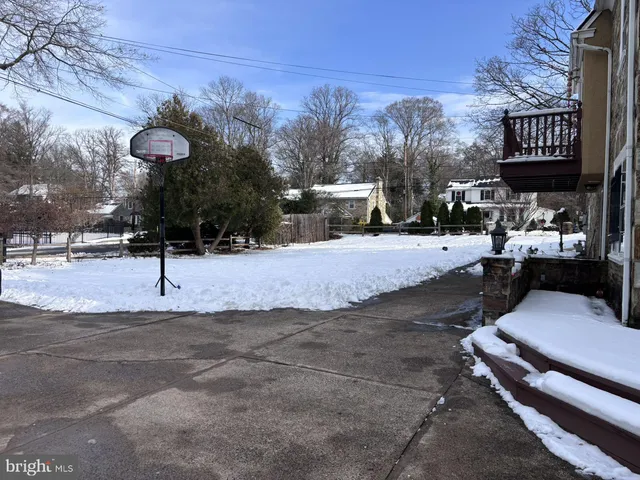 a street view with couple of cars parked on road