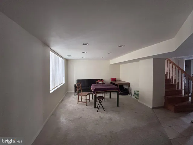 a view of a livingroom with furniture and window