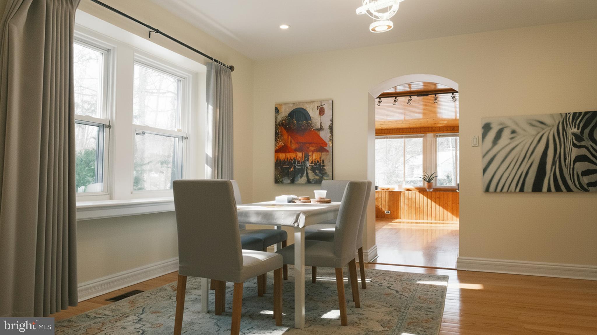 1058 Huntingdon Pike Huntingdon Valley, PA 19006 - Photo 7 of 25 a dining room with furniture a chandelier and wooden floor