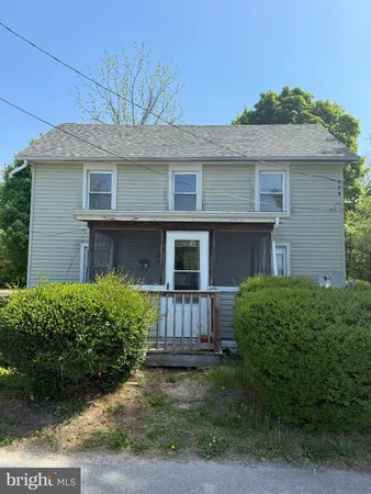 a view of a house with a yard and plants