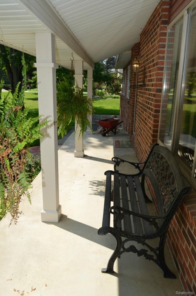 15098 Eddy Lake Road Fenton, MI 48430 - Photo 72 of 84 covered porch- the perfect place to have your morning coffee/tea!