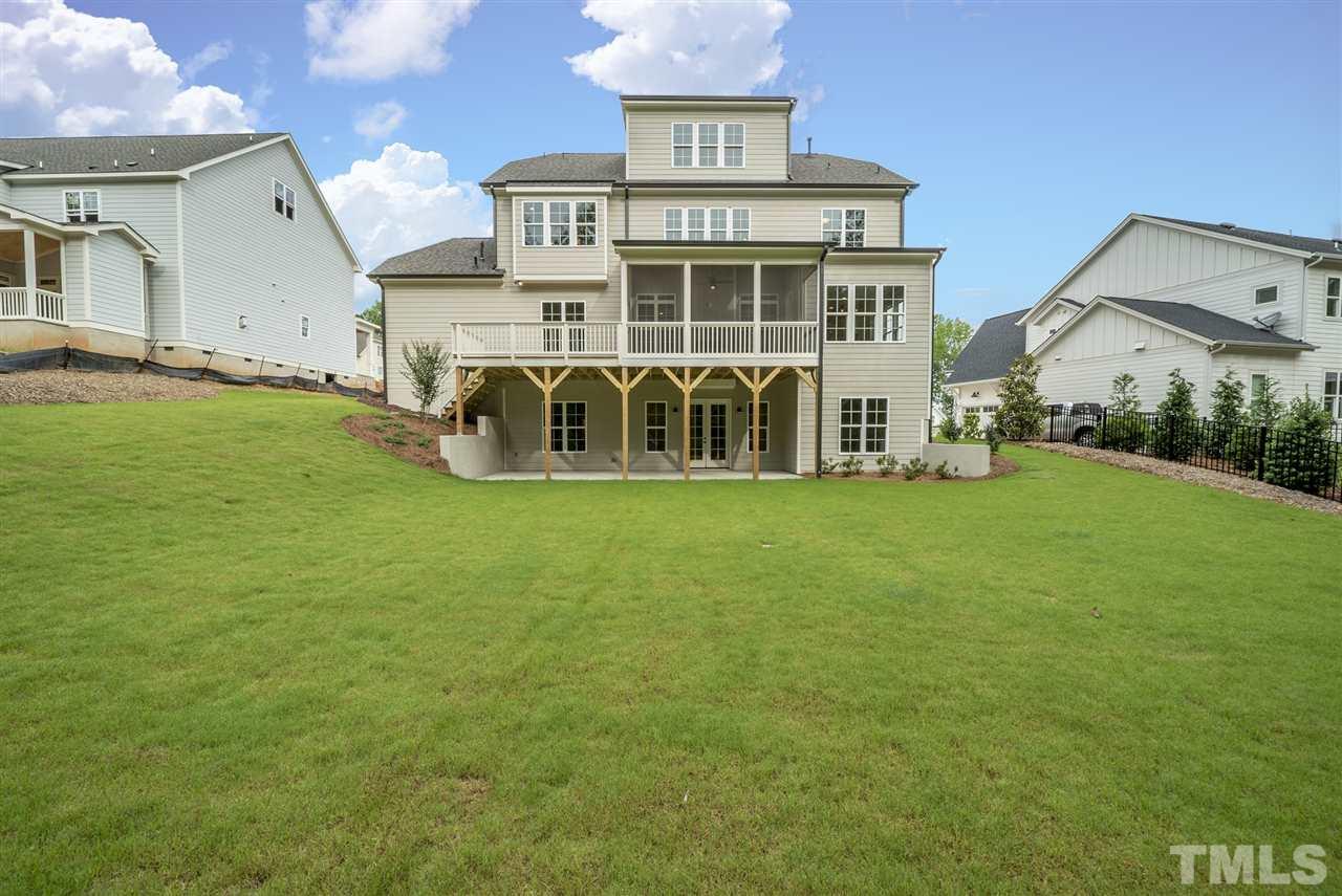 113 Roseroot Court Holly Springs, NC 27540 - Photo 2 of 25 a view of a house with a yard