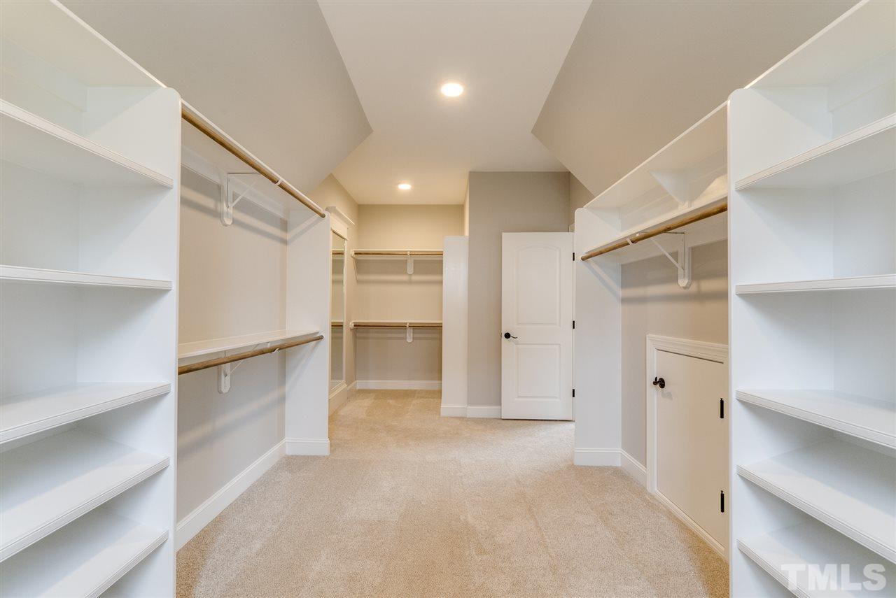 113 Roseroot Court Holly Springs, NC 27540 - Photo 11 of 25 a view of an empty walk in closet