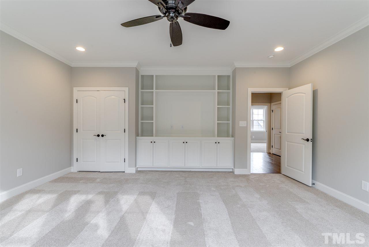 113 Roseroot Court Holly Springs, NC 27540 - Photo 12 of 25 an empty room with closet and windows