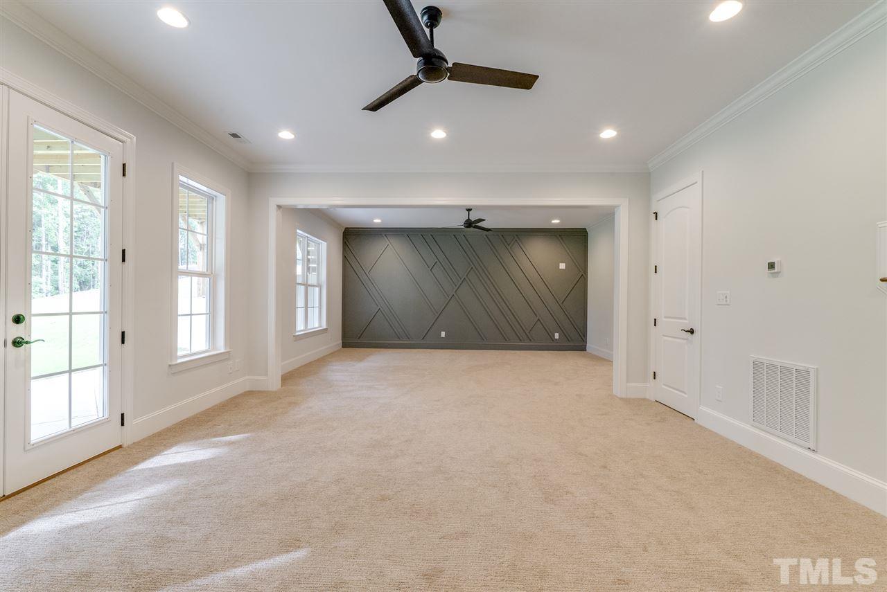 113 Roseroot Court Holly Springs, NC 27540 - Photo 13 of 25 a view of an empty room with a window