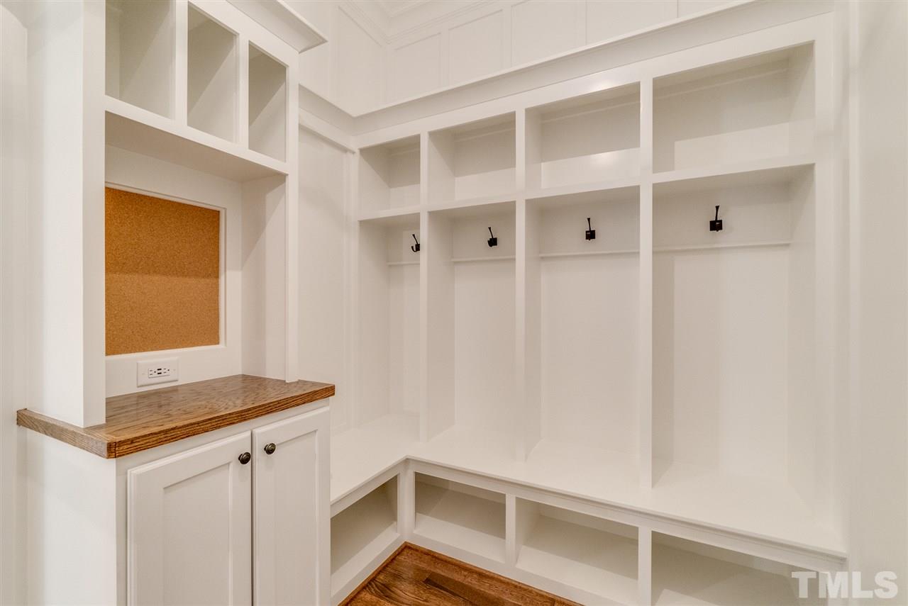 113 Roseroot Court Holly Springs, NC 27540 - Photo 15 of 25 a view of walk in closet with empty racks