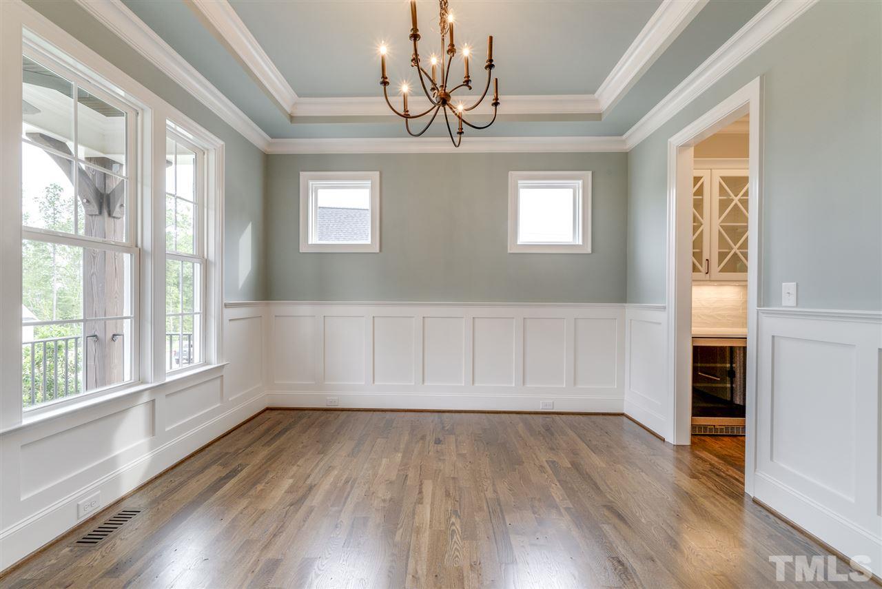 113 Roseroot Court Holly Springs, NC 27540 - Photo 4 of 25 a view of empty room with wooden floor and fan