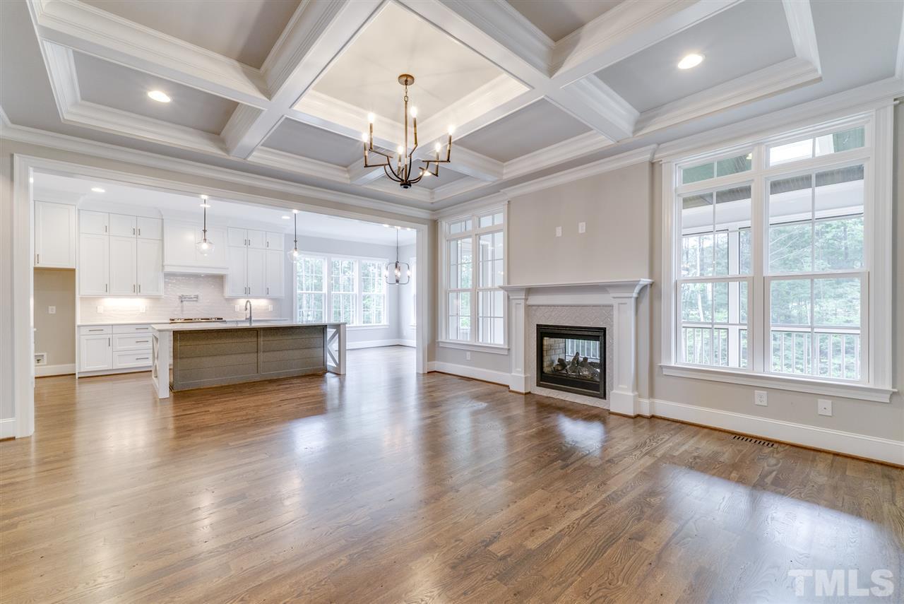 113 Roseroot Court Holly Springs, NC 27540 - Photo 5 of 25 a view of a room with stainless steel appliances wooden floor and a kitchen